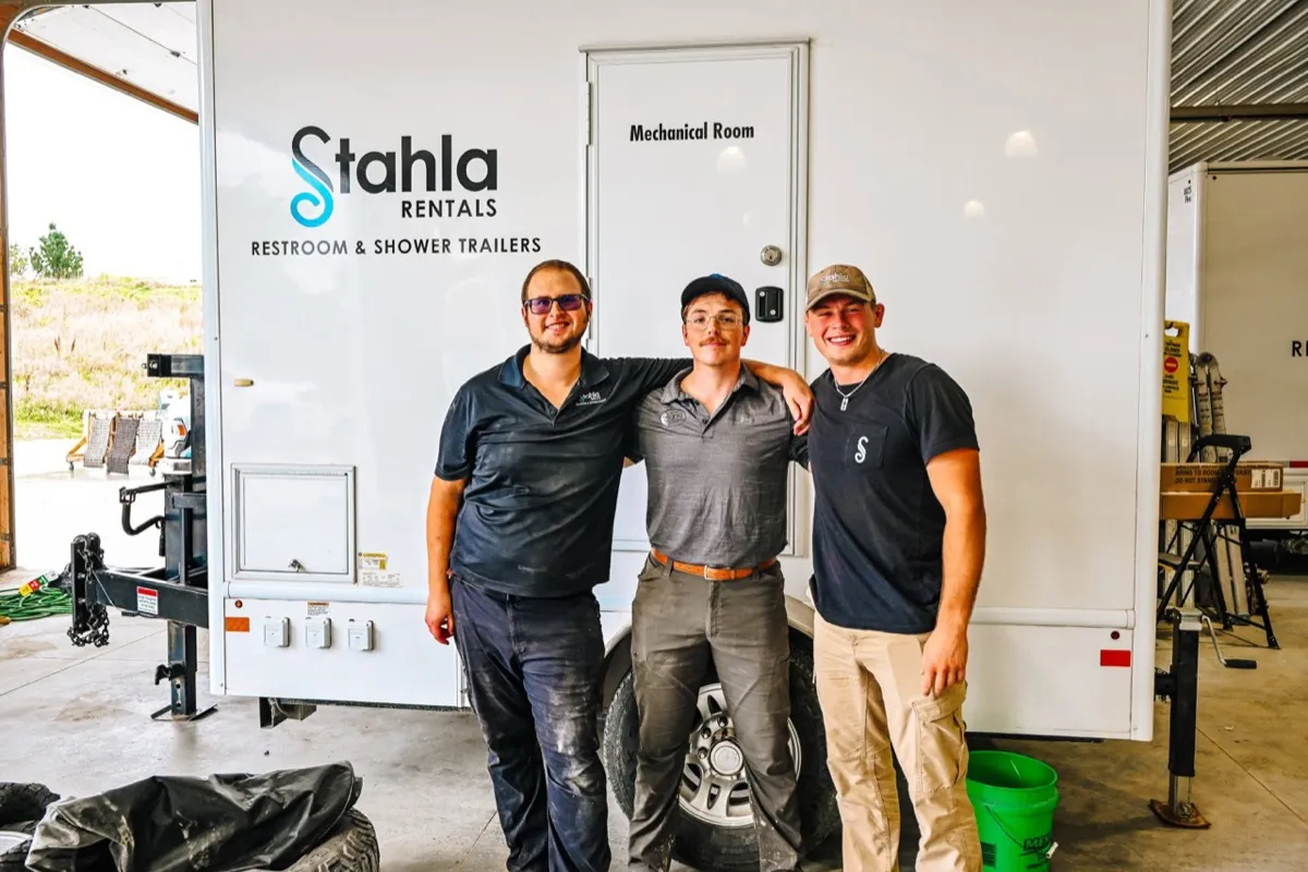 Stahla team in front of branded trailer